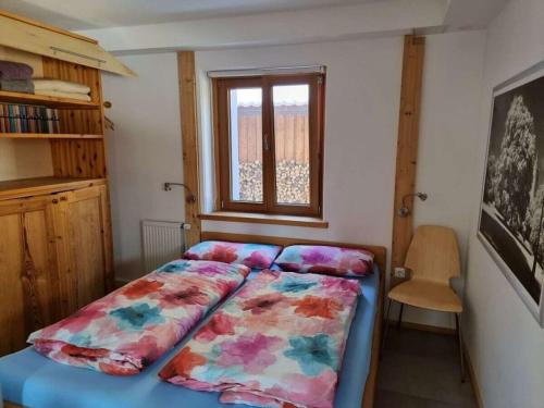 En eller flere senge i et værelse på Holiday home Ammergau Alps