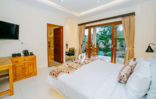 Postel nebo postele na pokoji v ubytování BeMas Villa