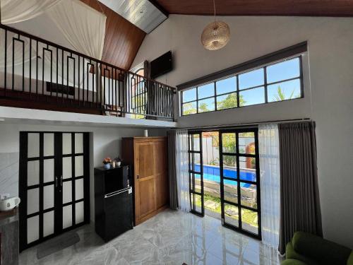 Kuchyň nebo kuchyňský kout v ubytování Ubud Suarga Private Pool Villa