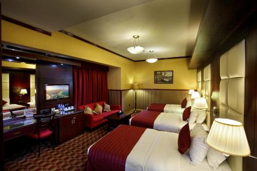 Ένα δωμάτιο στο Benta Grand Hotel LLC