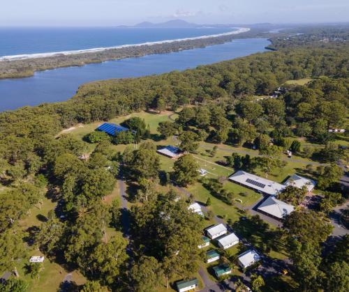an aerial view of a park next to the water at Yarra Holiday Park in Stuarts Point