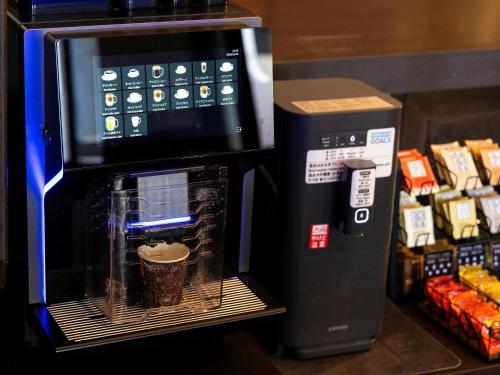 a microwave oven with a cup inside of it at KOKO STAY Shonan Fujisawa - formerly Hotel Wing International Shonan Fujisawa in Fujisawa