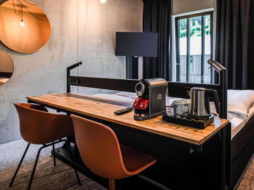 TV a/nebo společenská místnost v ubytování Hotel Valkenburg by Mercure - Next to Shimano Experience Center