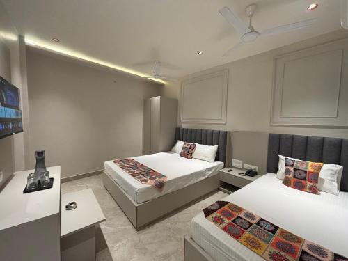 En eller flere senge i et værelse på Hotel Golden Hills