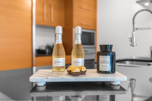 two bottles of wine on a table in a kitchen at Brickell 35th Floor Residence with Saltwater Pool 5-Star Amenities in Miami