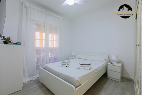 En eller flere senge i et værelse på Apartamento El Bajondillo