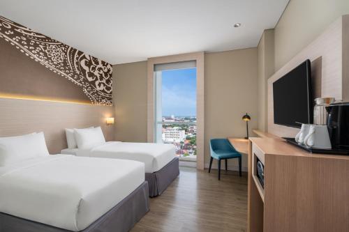 Ένα ή περισσότερα κρεβάτια σε δωμάτιο στο Mercure Solo