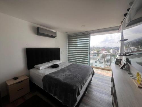 Postel nebo postele na pokoji v ubytování apartamento torre epic