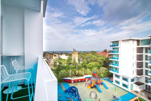 a view from an apartment balcony with a playground at My Resort Hua Hin Service Apartment with Seaview in Hua Hin
