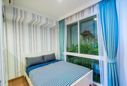 Кровать или кровати в номере My Resort Hua Hin Service Apartment with Seaview