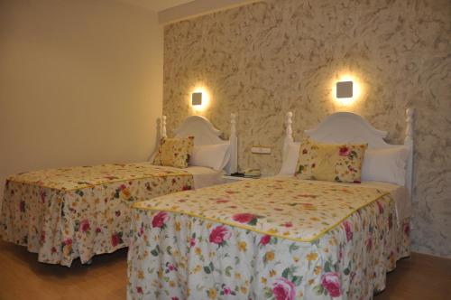Postel nebo postele na pokoji v ubytování Hotel Selu