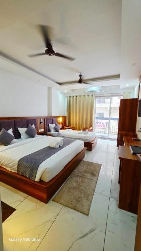 En eller flere senge i et værelse på Hotel Tapomay Retreat