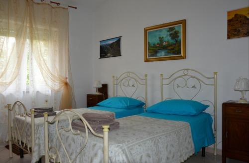 Posteľ alebo postele v izbe v ubytovaní Pietro & Graziella