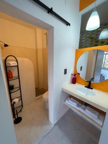 a bathroom with a sink and a mirror at Casa Dreamy in Zihuatanejo