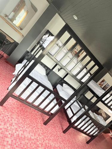 an overhead view of a room with bunk beds at Destiny House Hostel in Hat Yai
