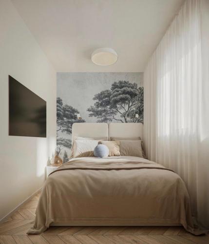 a bedroom with a bed with a painting on the wall at Apartment Solis 8 in Stara Novalja