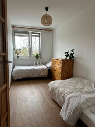 En eller flere senge i et værelse på Lakes & Castles Apartment