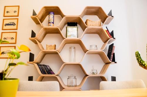 a room with wooden bookshelves on the wall at CoreHome in Albano Laziale