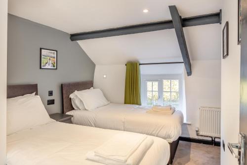 En eller flere senge i et værelse på Lanreath Cottage 3 bedroom with Hot Tub