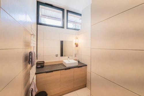 a bathroom with a sink and a mirror at Domaine le Vaxergues in Saint-Affrique
