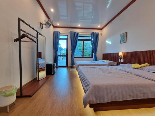 Postel nebo postele na pokoji v ubytování BeanHomestay