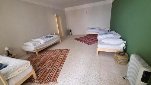 Ένα ή περισσότερα κρεβάτια σε δωμάτιο στο Gemütliches Zimmer in Douz - Oase der Ruhe