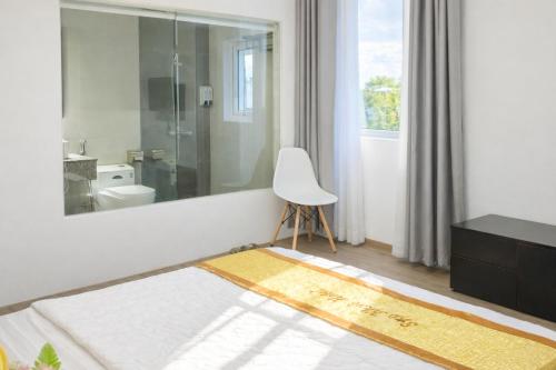 Postel nebo postele na pokoji v ubytování Sao Khue Hotel
