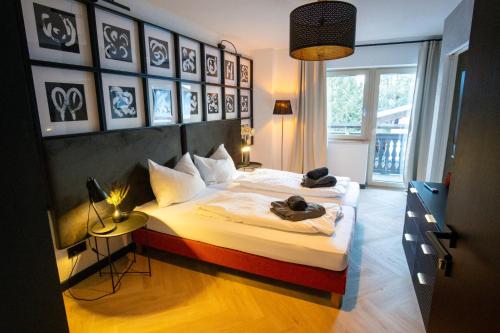 a bedroom with two beds with towels on them at Appartements Cafe Schneider in Sankt Anton am Arlberg