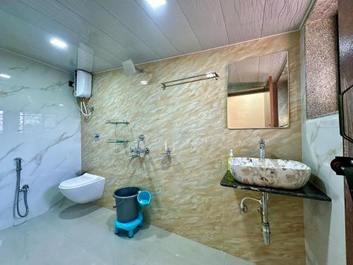 a bathroom with a sink and a toilet at Heaven-The Mannat Sanctuary in Lonavala