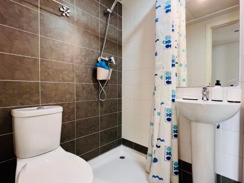 a bathroom with a toilet and a sink at Calamora I by Sun & Sea Homes in Moraira