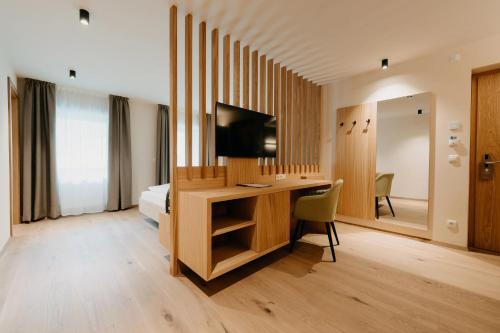 TV a/nebo společenská místnost v ubytování New Hotel Murrer