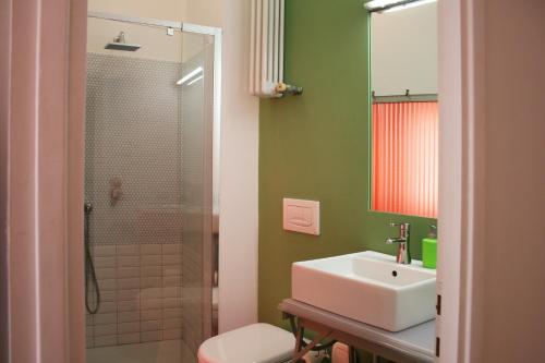 a bathroom with a sink and a shower at B&B Loft Padova in Padova