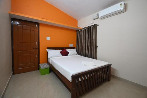 Postel nebo postele na pokoji v ubytování Arunodaya The Dream Den