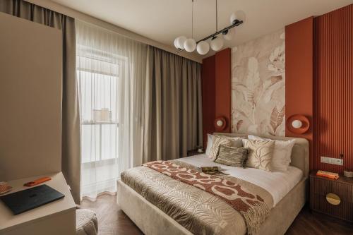 a hotel room with a bed and a window at Electra Apartments in Krakow