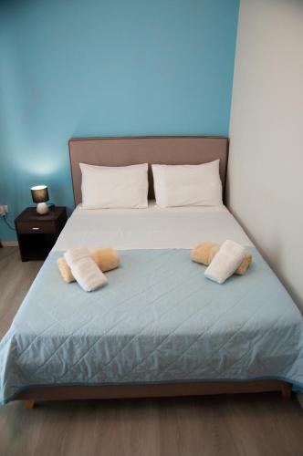 a bedroom with a bed with two pillows on it at ΛΙΜΑΝΙ in Chios