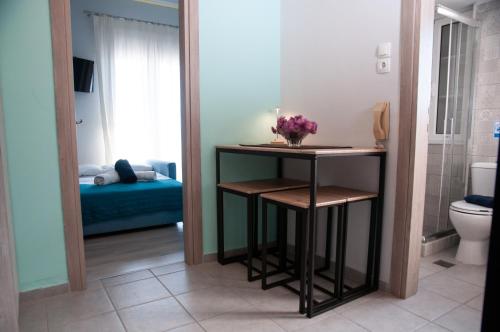 a bathroom with a table and a toilet in a room at ΛΙΜΑΝΙ in Chios