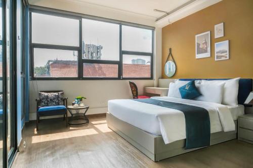 En eller flere senge i et værelse på LPM Apartment Pho Hue