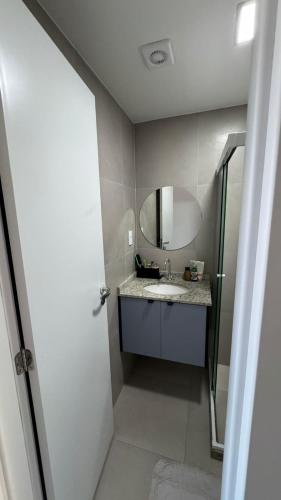 a bathroom with a sink and a mirror at Full Studio in Stella Maris in Salvador