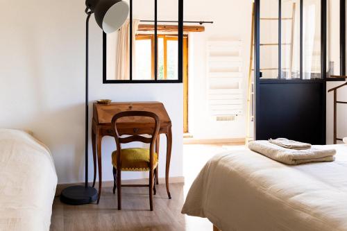 Letto o letti in una camera di L'Auberge des Clés