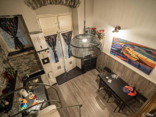an overhead view of a living room with a table and chairs at Petrella's Point Studio with AC in Vernazza