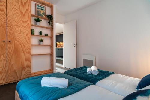 Postel nebo postele na pokoji v ubytování Le Chant des Vagues - A quelques min de Carnac