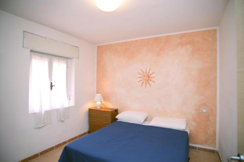 Posteľ alebo postele v izbe v ubytovaní Appartamenti Mare Blu