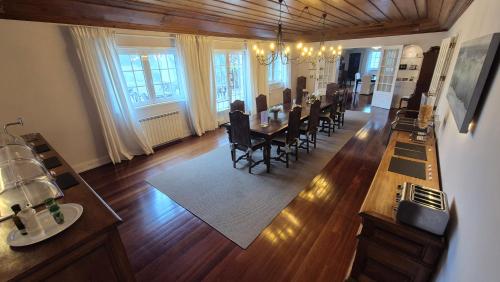 an aerial view of a dining room and living room at Quinta do Cabo Guesthouse in Sintra
