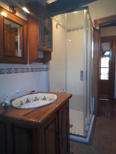 a bathroom with a sink and a shower at R2R - Ático con encanto Colindres - C08B01 in Colindres