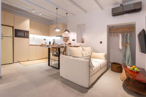 a living room with a couch and a kitchen at stema suite 1 in Tripiti