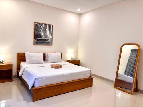 Een bed of bedden in een kamer bij Kampana Homestay