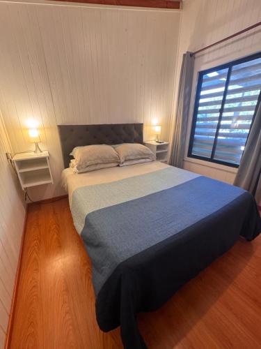 Postel nebo postele na pokoji v ubytování Cabañas entre Talca y Maule, en Piedras Blancas