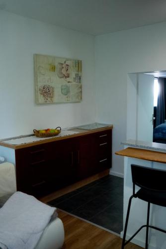 a kitchen with a counter with a banana sitting on a desk at CALM HOME im Erdgeschoss mit eigenem Eingang in Bad Oeynhausen