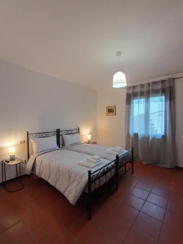 En eller flere senge i et værelse på Agriturismo Carne Sicura