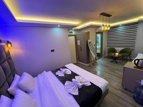 a hotel room with a bed with flowers on it at GALATAGREENAPPLEHOTEL in Istanbul